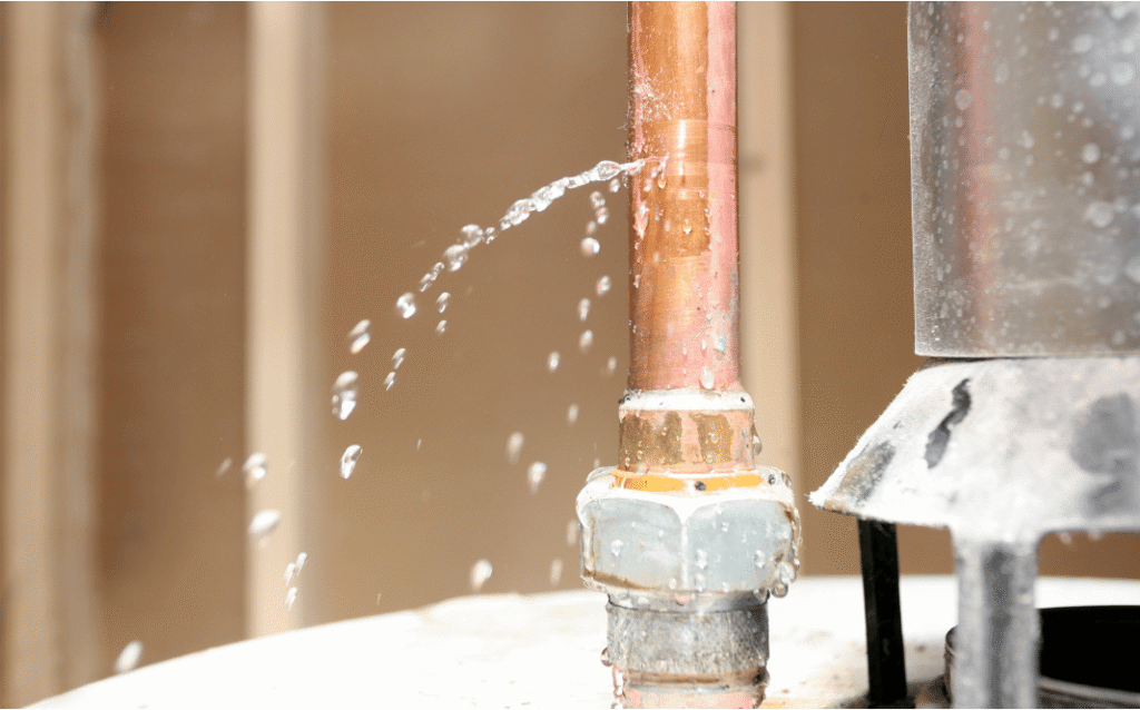 Plumbing pipe showing signs of leaking and damage