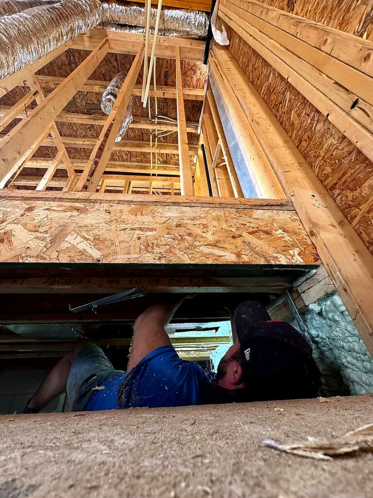 Plumber installing plumbing systems during a new home build in London Ontario